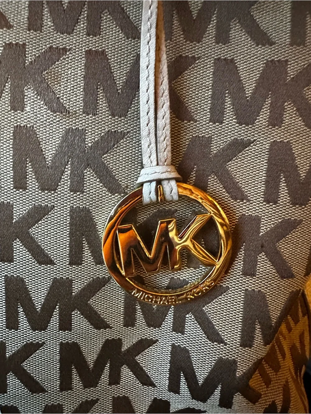 Authentic Michael Kors beige MK Signature Tote with Logo Charm